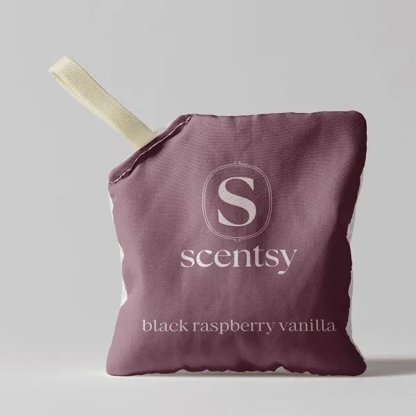 Plump burgundy fabric pouch with cream-coloured ribbon handle, displaying the Scentsy logo and "Black Raspberry Vanilla Scent Pak" text in white