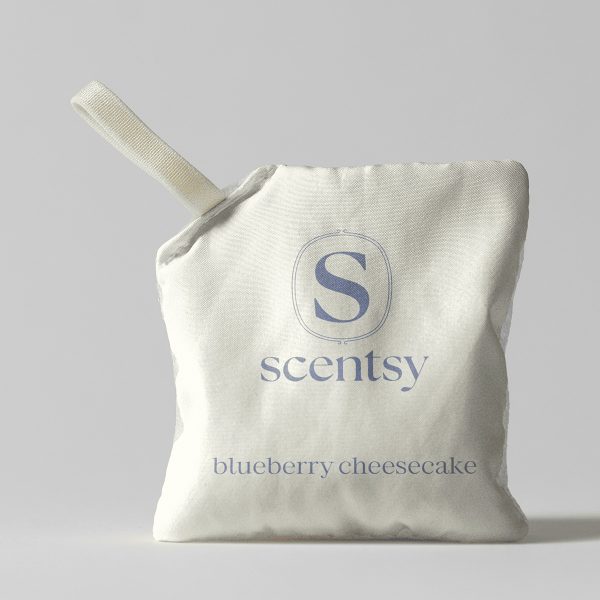 Cream-coloured fabric pouch with a blue Scentsy logo and text reading "blueberry cheesecake" for the Blueberry Cheesecake Scent Pak, with a ribbed fabric handle