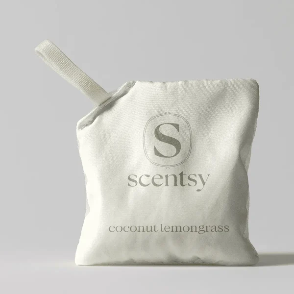 Cream-coloured fabric pouch with a drawstring closure displaying the Scentsy logo and "Coconut Lemongrass Scent Pak" text printed in grey