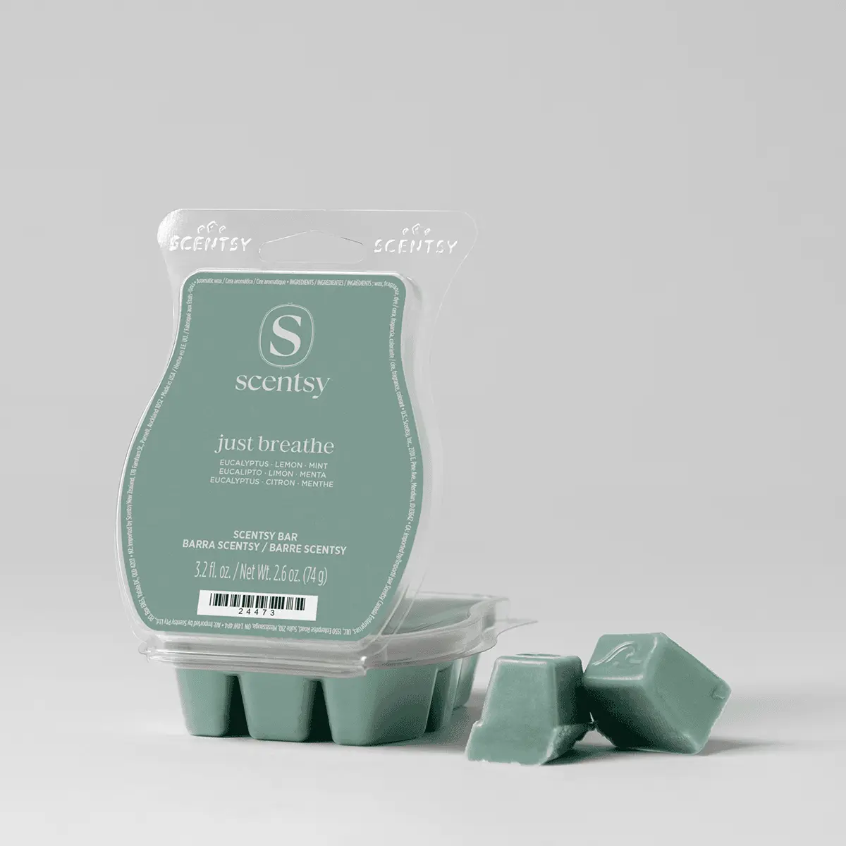 Sage green wax cubes in a clear clamshell pack with a matching green label beside two loose cubes, the Just Breathe Scentsy Bar