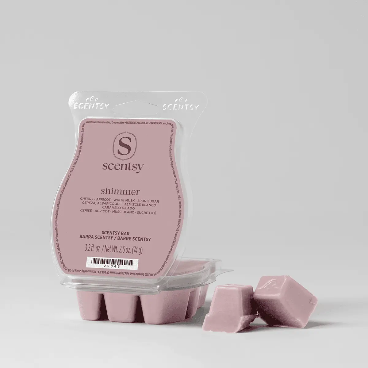 Pale pink wax melts in a clear clamshell package with Scentsy branding, showing the Shimmer Scentsy Bar label with scent notes and product details, with individual wax cubes displayed in front