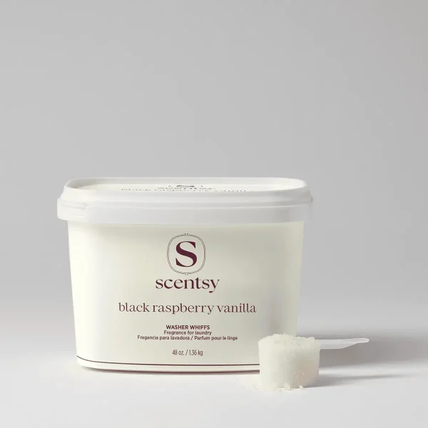 White cylindrical tub with white lid containing Black Raspberry Vanilla Washer Whiffs Tub, with a measuring scoop of white granules positioned beside it