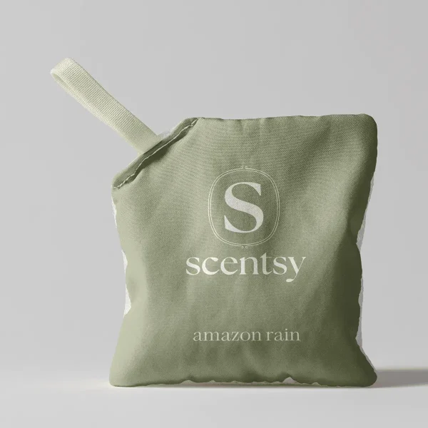 Sage-green fabric pouch with a cream-coloured drawstring, embossed with the Scentsy logo and text reading "amazon rain", the Amazon Rain Scent Pak