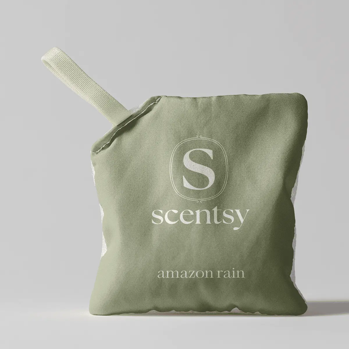 Sage-green fabric pouch with a cream-coloured drawstring, embossed with the Scentsy logo and text reading "amazon rain", the Amazon Rain Scent Pak