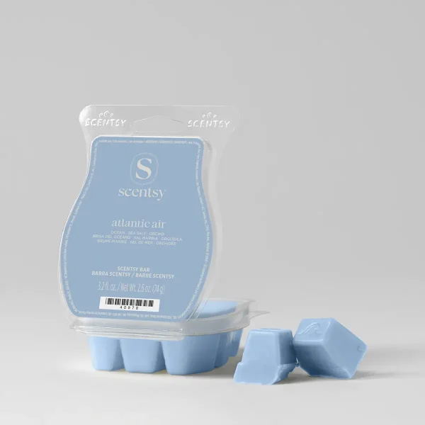 Light blue wax cubes in a clear clamshell tray with a pale blue Scentsy label, two cubes broken off beside it, the Atlantic Air Scentsy Bar