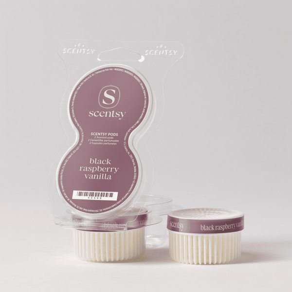 Clear plastic clamshell package containing two cream-coloured wax pods with mauve labels, Black Raspberry Vanilla Scentsy Pods, displayed with packaging behind them