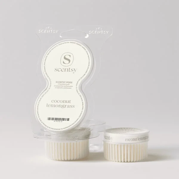 Two cream-coloured Scentsy Pods with vertical ridged sides in their clear plastic clamshell packaging, labelled Coconut Lemongrass Scentsy Pods, with branded hang tabs and product information visible on the blister card.