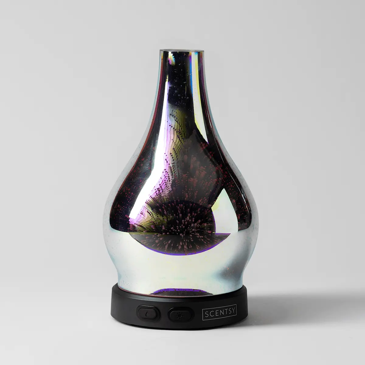 Teardrop-shaped diffuser with iridescent black and white finish featuring a dimensional starburst pattern, mounted on a black base with Scentsy branding and control buttons