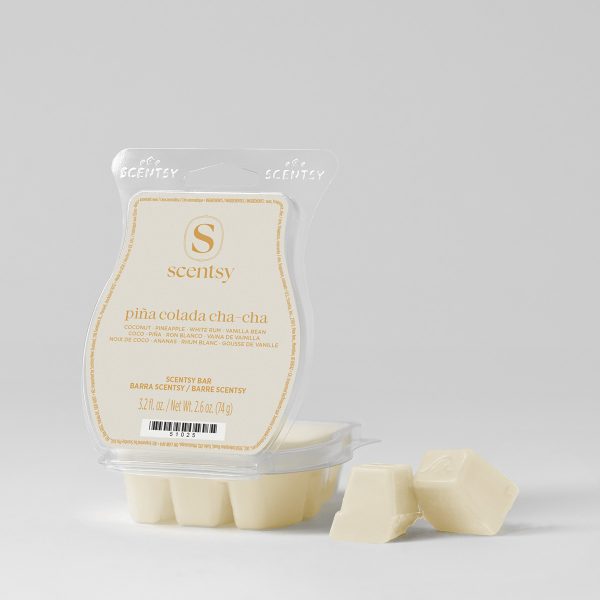 Cream wax bar in a clear clamshell with a cream label, beside two broken-off cubes, the Pina Colada Cha-Cha Scentsy Bar