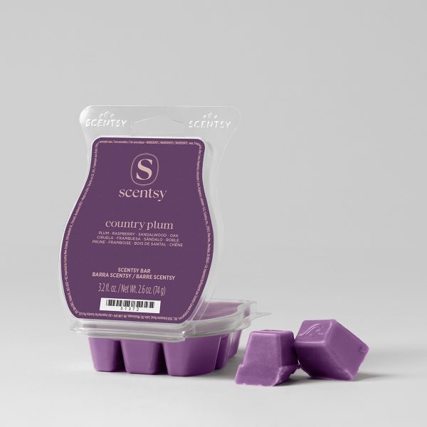 Purple wax bar with rounded edges in a clear clamshell package showing the Country Plum Scentsy Bar label, with four broken pieces displayed in front