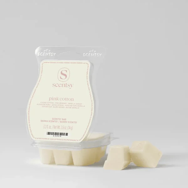 Cream-coloured wax melt bar in clear plastic clamshell packaging with pink text and Scentsy branding, the Pink Cotton Scentsy Bar, shown with three individual wax cubes beside the package