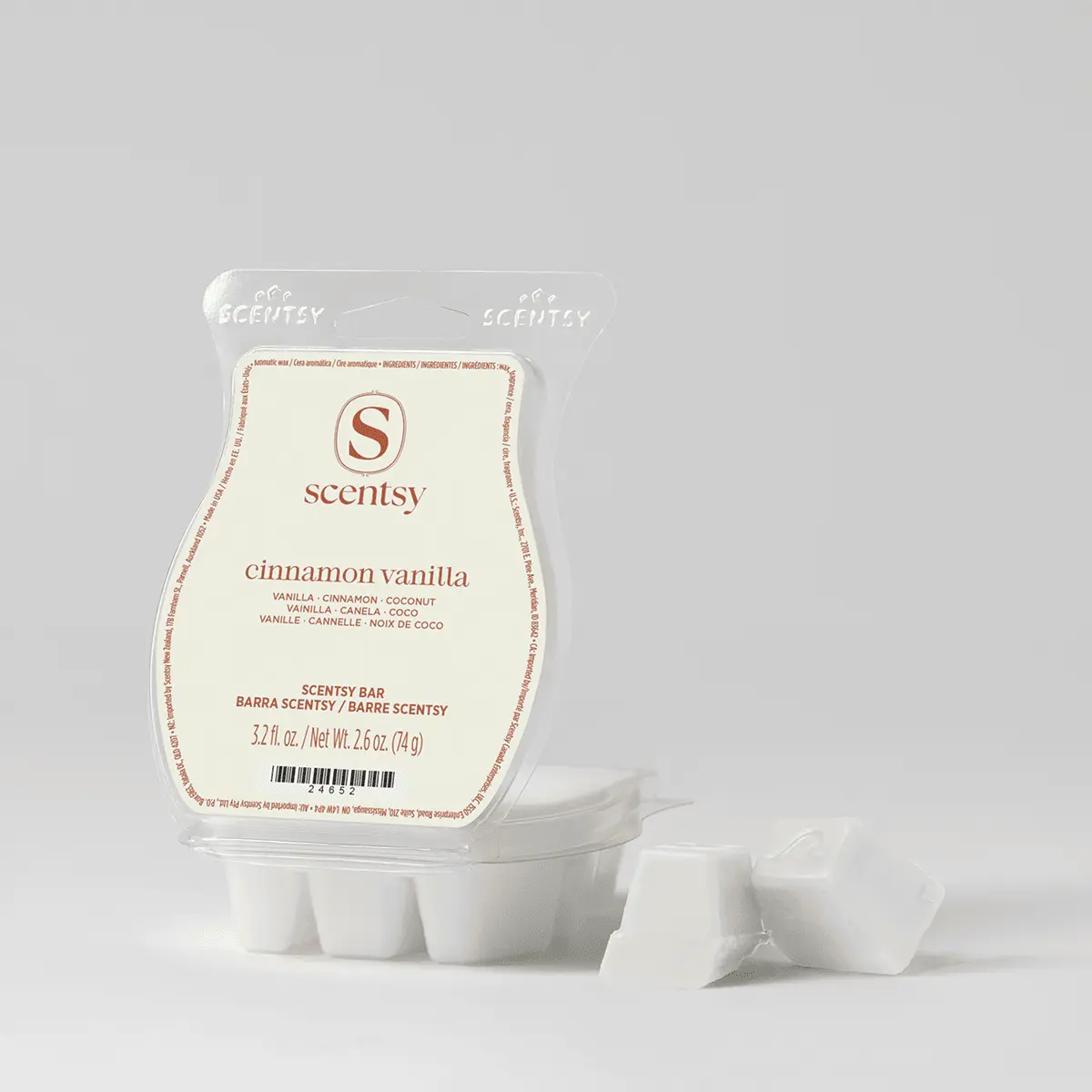 Cinnamon Vanilla Scentsy Bar in cream-coloured wax with brown label showing ingredient list, displayed with six individual wax cubes arranged below the clear plastic clamshell packaging