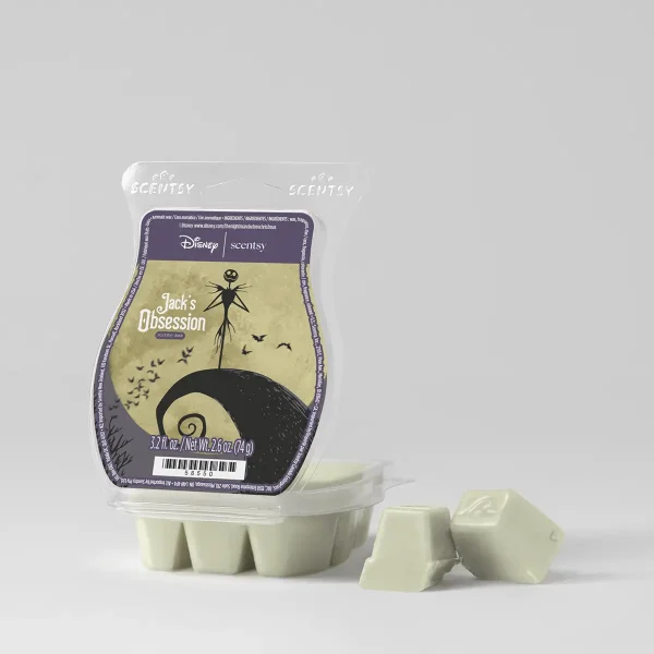 Pale yellow-green Scentsy wax bar with black skeletal character illustration and flying bats, packaged in clear clamshell with purple and yellow Disney Scentsy label, The Nightmare Before Christmas: Jack's Obsession Scentsy Bar, with individual wax cubes displayed in front