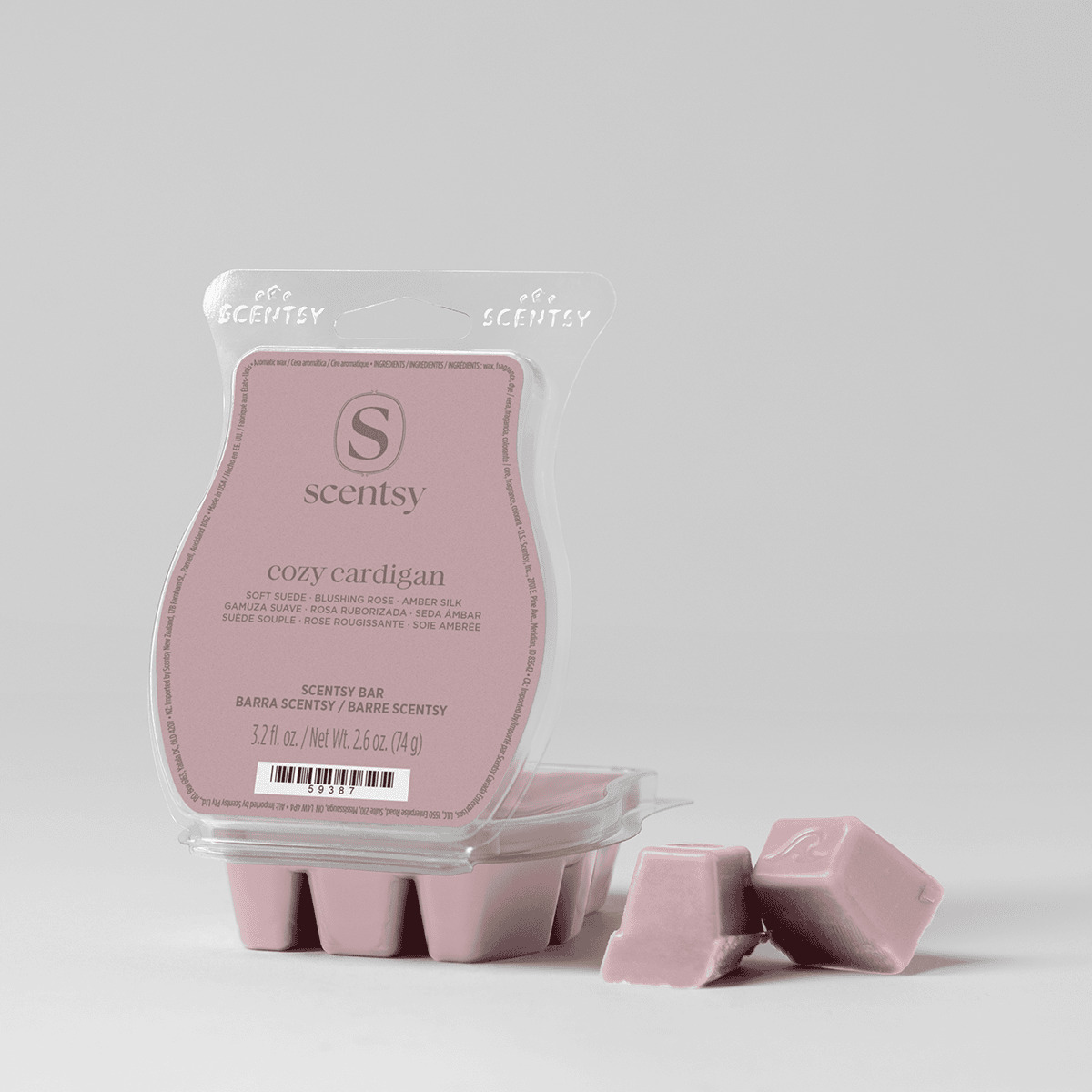 Pink wax melt bar in clear clamshell packaging showing the Scentsy logo and scent name, with individual wax cubes displayed in front, the Cozy Cardigan Scentsy Bar