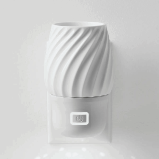 White ceramic diffuser with diagonal swirl pattern and lower matte finish base featuring a power button, the Scentsy Air Mini+ - Swivel