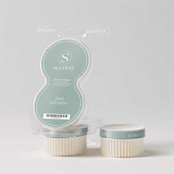 Pale green and cream Scentsy Pods packaging with two scented pods displayed in front, labelled Just Breathe Scentsy Pods, in clear clamshell blister pack with handle