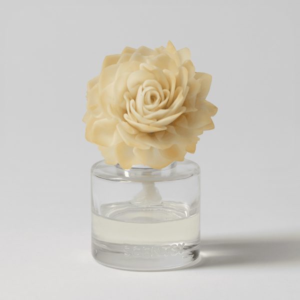 Cream-coloured rose with layered petals, mounted on a clear glass diffuser base filled with pale liquid, the Vanilla Bean Buttercream - Dahlia Darling Fragrance Flower