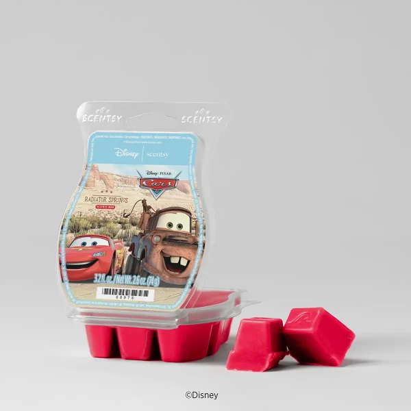 Bright pink wax melts in a clear plastic clamshell with Disney and Pixar Cars branding featuring Lightning McQueen and Mater at Radiator Springs, the Cars: Radiator Springs Scentsy Bar