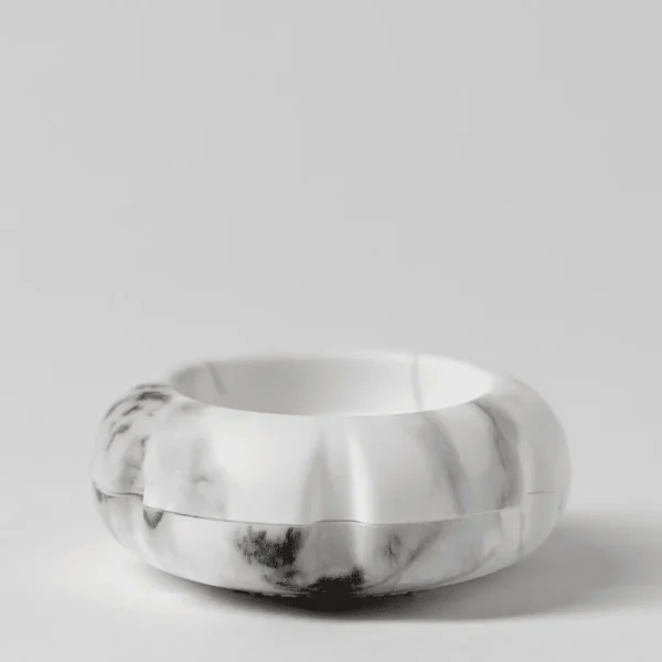 White and grey marble-patterned diffuser with a rounded, ribbed body and open top, the Scentsy Air Solo - Marble White