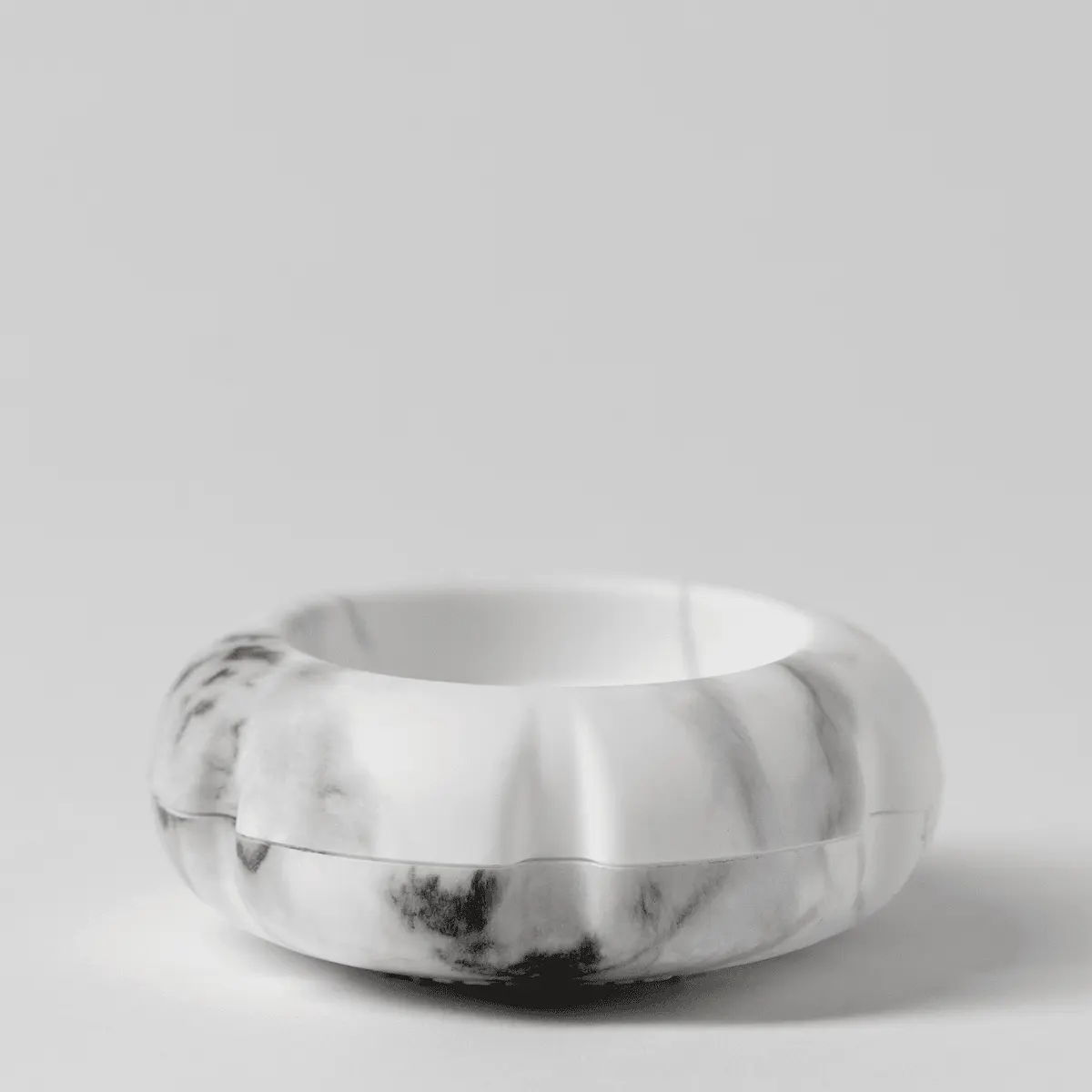 White and grey marble-patterned diffuser with a rounded, ribbed body and open top, the Scentsy Air Solo - Marble White