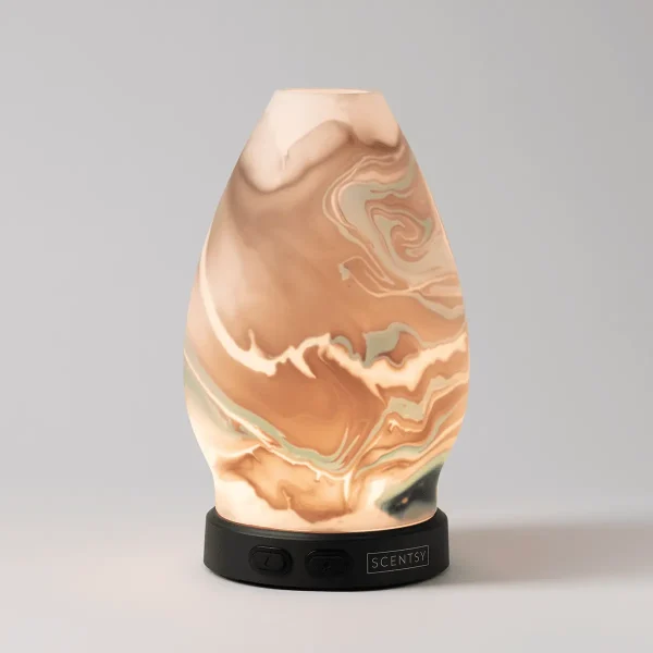 Teardrop-shaped ultrasonic diffuser with cream and terracotta swirled marble pattern, illuminated from within, mounted on a black base with Scentsy branding, the Explore - Scentsy Diffuser