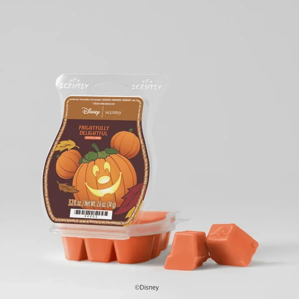 Orange wax bar in clear packaging with a Mickey-shaped jack-o'-lantern and autumn leaves label, the Disney Frightfully Delightful Scentsy Bar, with two loose cubes