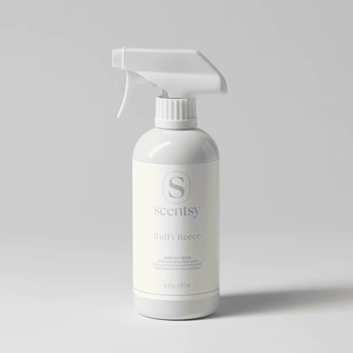 White spray bottle with trigger applicator labelled Scentsy Fluffy Fleece Scentsy Fresh fabric spray, 475 ml