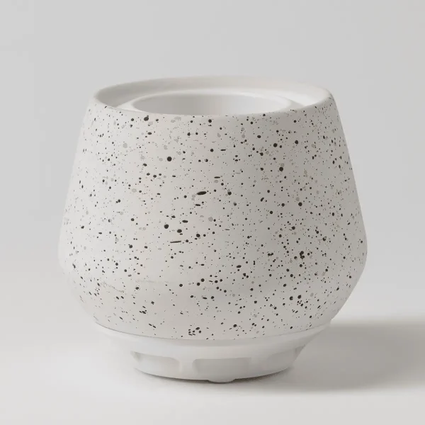White ceramic diffuser with black speckled texture throughout, rounded tapered shape with a wide opening at the top, the Scentsy Air - Bespeckled