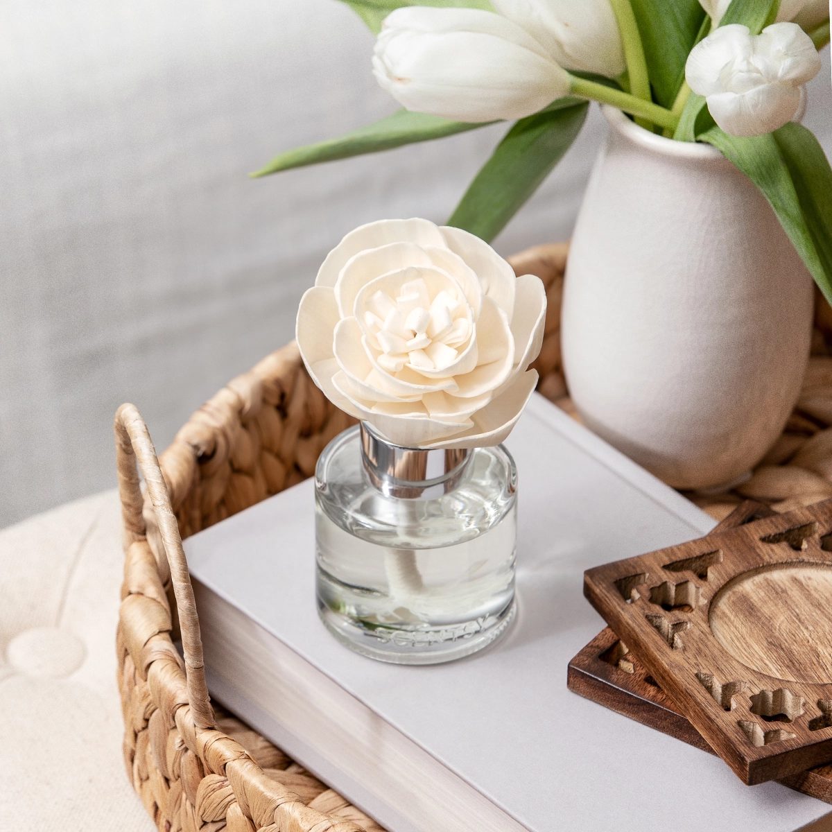 Cream peony-shaped Fragrance Flower with layered petals in a clear glass bottle filled with liquid, the Clothesline – Buttercup Belle Fragrance Flower