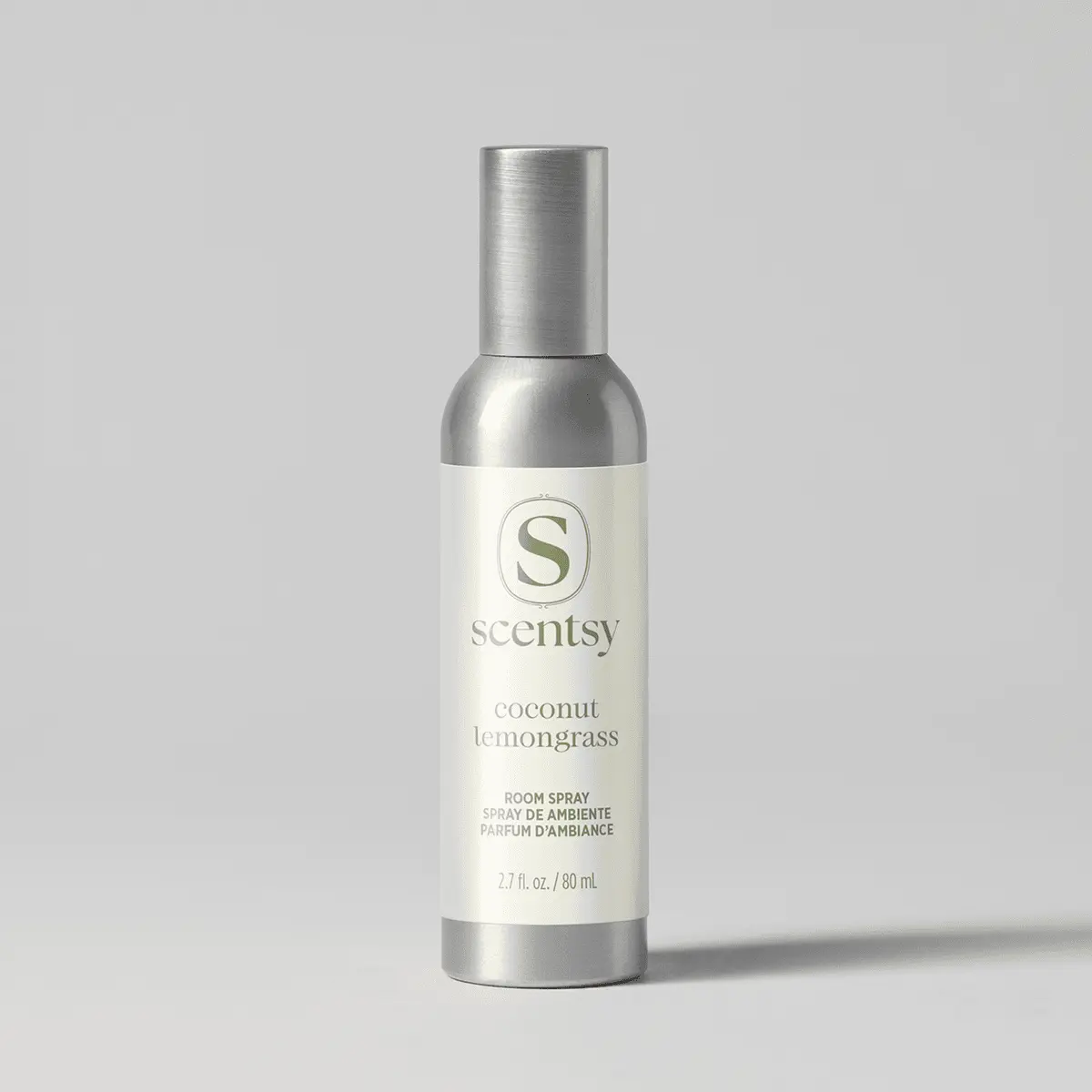 Cylindrical room spray bottle with brushed silver metal cap and base, cream-coloured label with the Scentsy logo and "Coconut Lemongrass Room Spray" text, 2.7 fl oz/80 mL