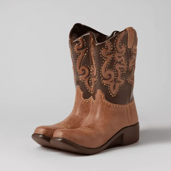 Two-tone ceramic cowboy boot warmer with tan suede-look lower section, dark brown ornate upper calf with copper scrollwork and studded detailing, the Rodeo Scentsy Warmer