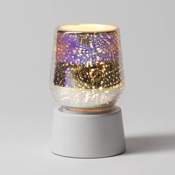 Glowing glass warmer with gold and purple speckled pattern over a white ceramic base, the Stargaze Mini Scentsy Warmer with Tabletop Base, illuminated from within