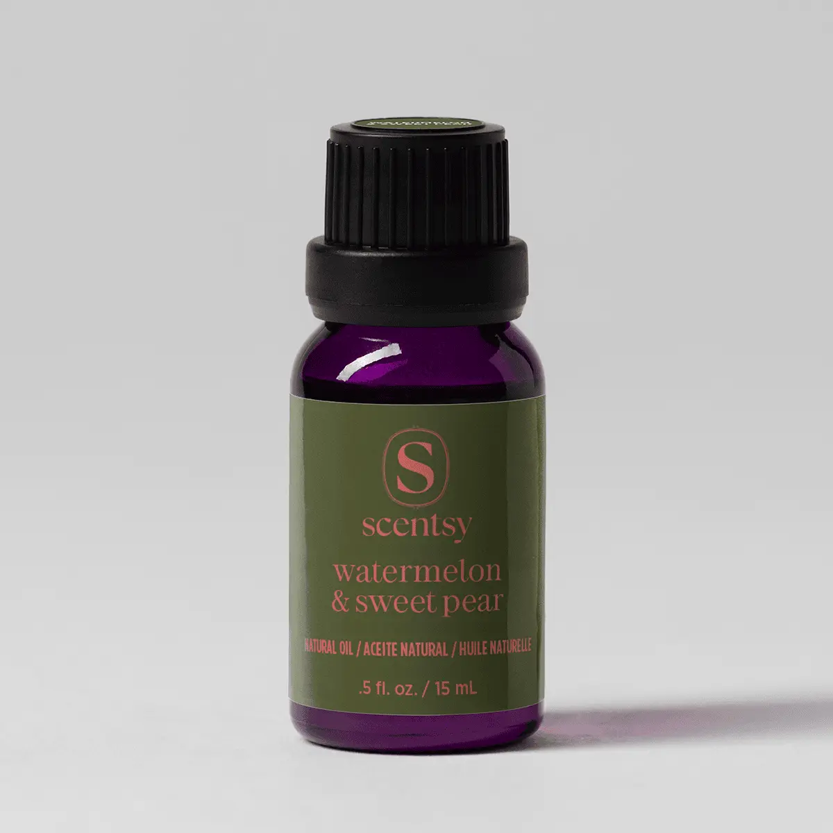 Watermelon & Sweet Pear Natural Oil Blend - Dark purple glass bottle with a black screw cap and olive-green label featuring the Scentsy logo, containing Watermelon & Sweet Pear Natural Oil Blend, 15 mL