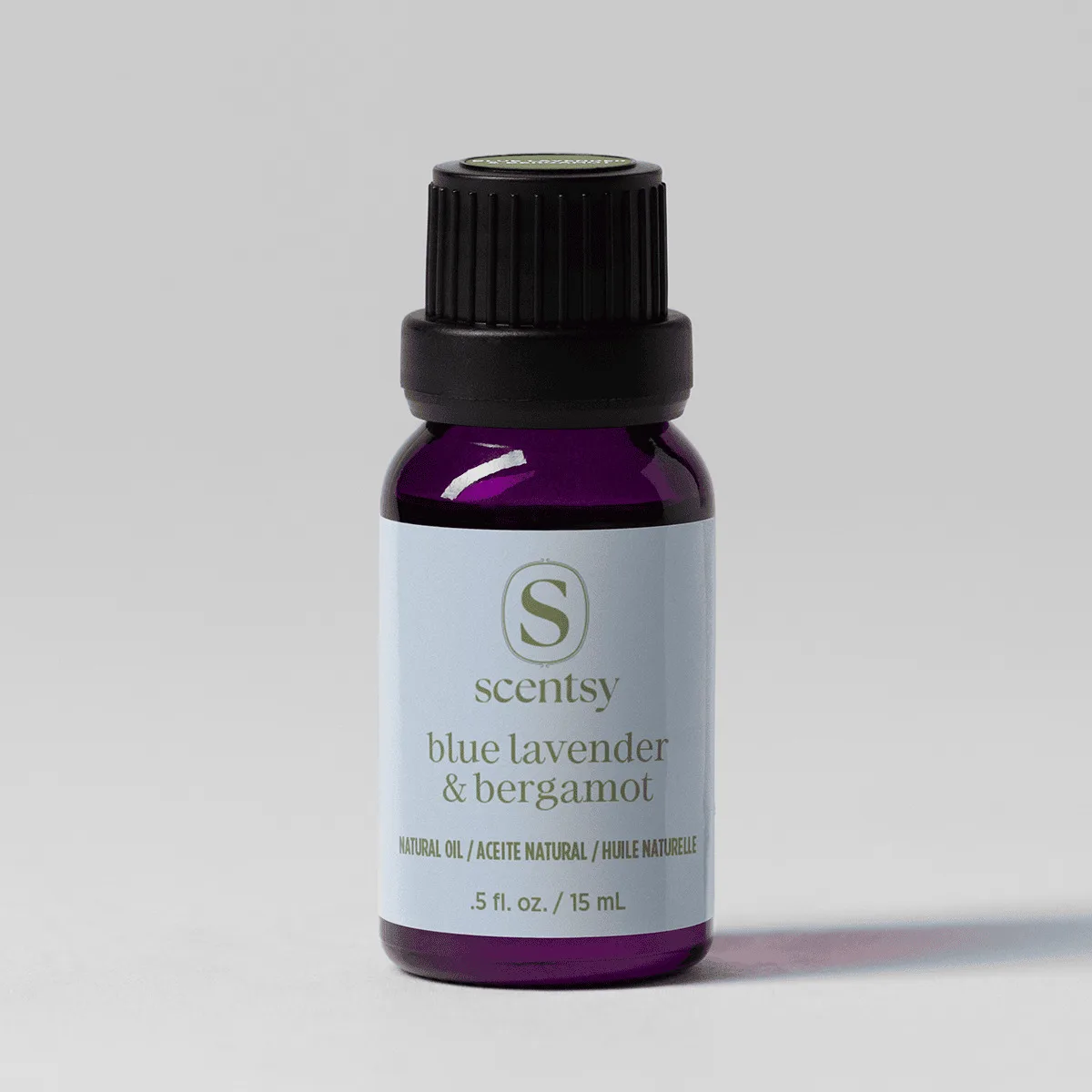 Blue Lavender & Bergamot Natural Oil Blend - Small dark glass bottle with black dropper cap containing deep purple natural oil, labelled Blue Lavender & Bergamot Natural Oil Blend, 15 mL