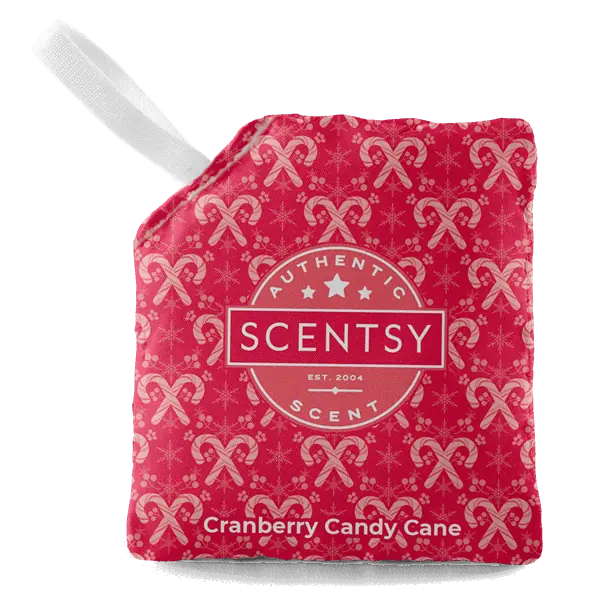 Bright pink Cranberry Candy Cane Scent Pak with repeating candy cane and star pattern, white ribbon loop, and Scentsy authentic scent badge