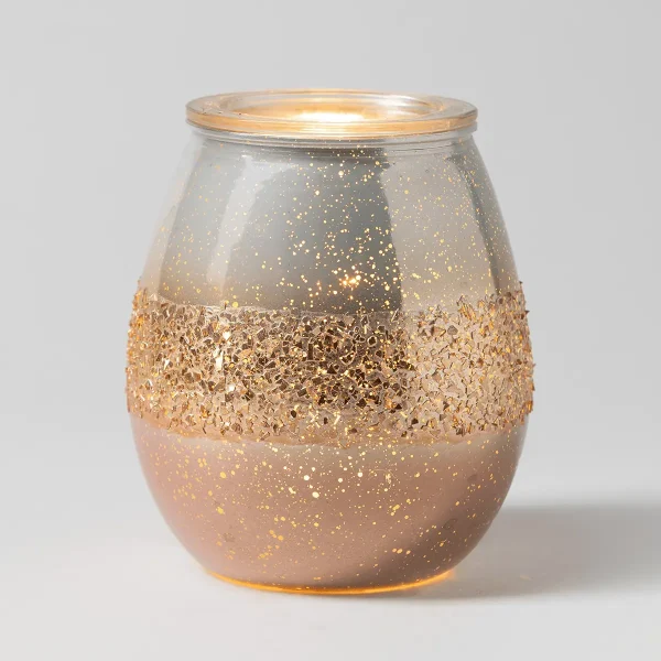 Rounded glass warmer with a two-tone design featuring a blush pink lower half and grey upper half, both dusted with gold glitter and sparkle, topped with a gold-toned lid, the Blushing Gold Scentsy Warmer
