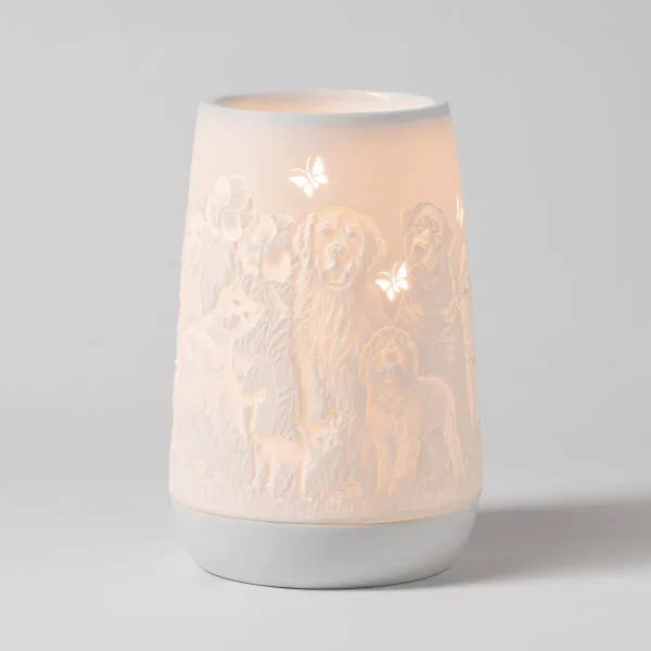 Cylindrical white ceramic warmer with embossed dogs and butterflies, illuminated from within, the Furry Friends Scentsy Warmer