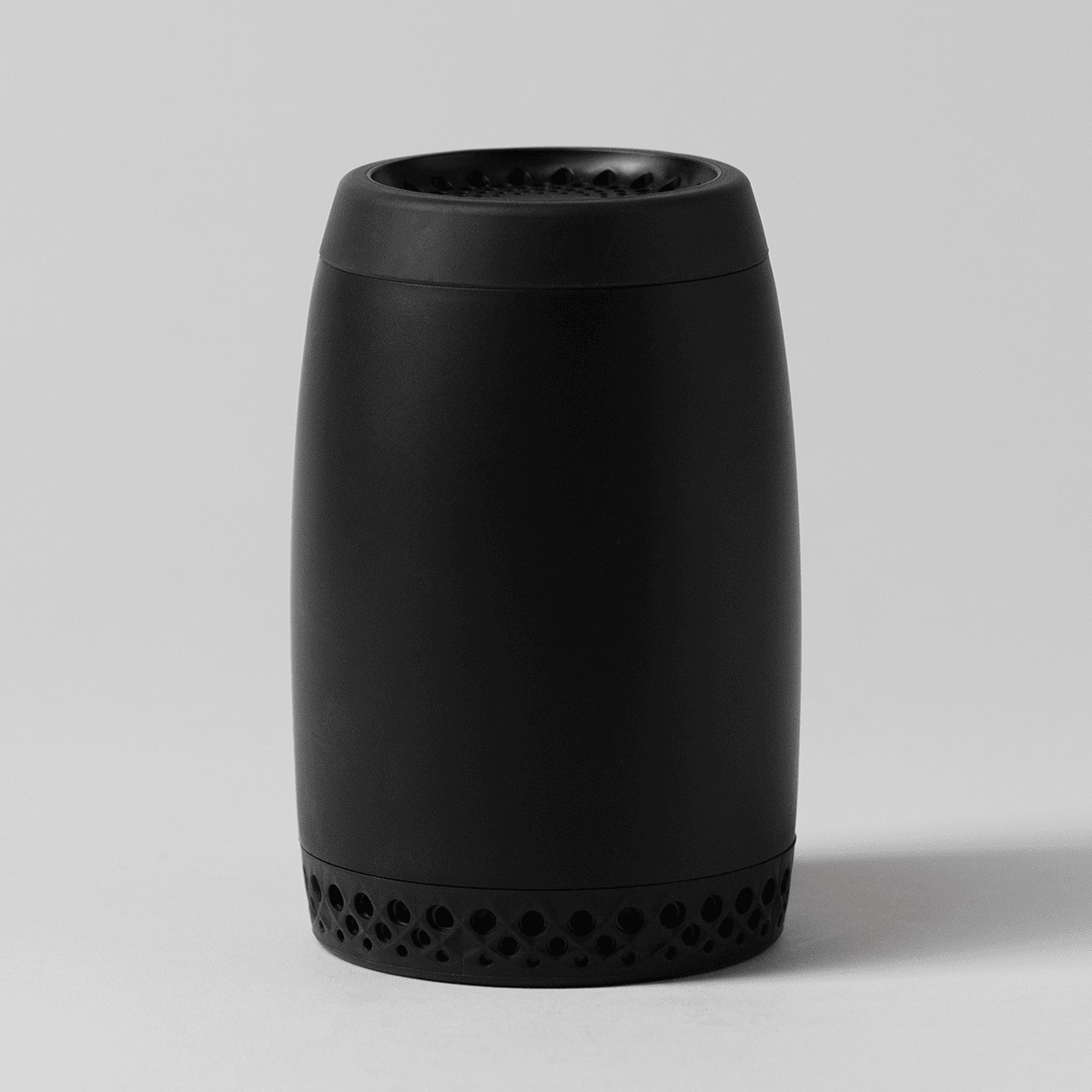 Matte black cylindrical diffuser with a perforated base band, the Scentsy Air Go - Black