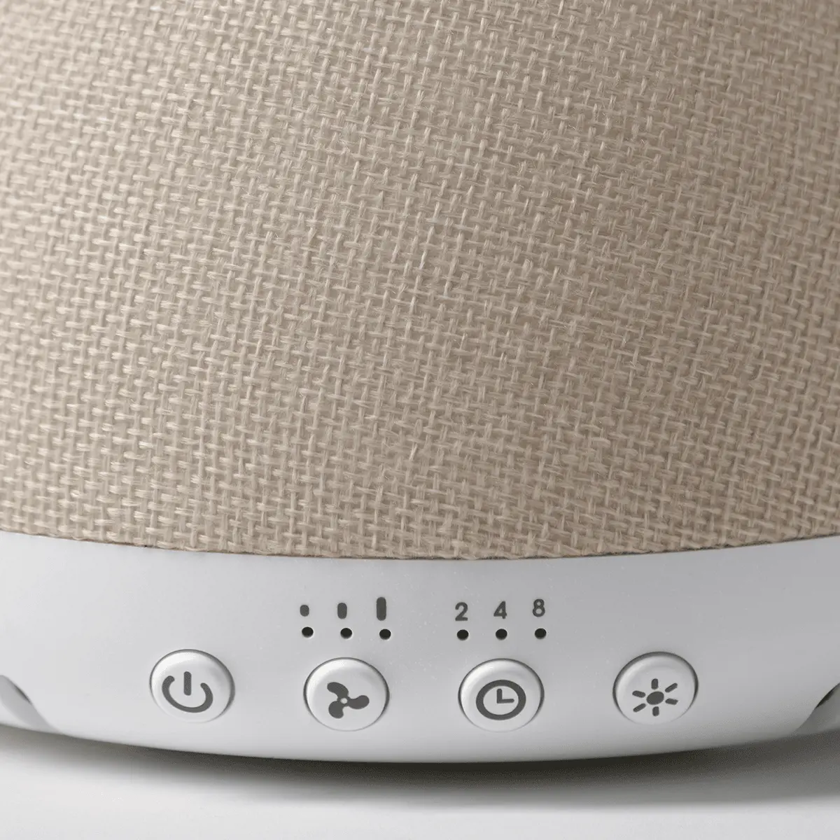 White Scentsy Air Quad diffuser with linen-textured fabric top and control buttons for power, mist, timer, and light intensity