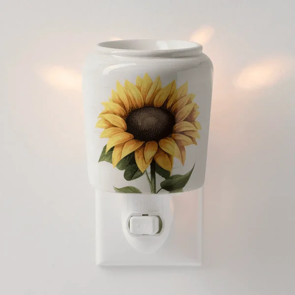 White ceramic mini warmer with a realistic sunflower illustration in golden yellow and green, mounted on a white wall plug base with an on/off switch, the Sunflower Mini Scentsy Warmer