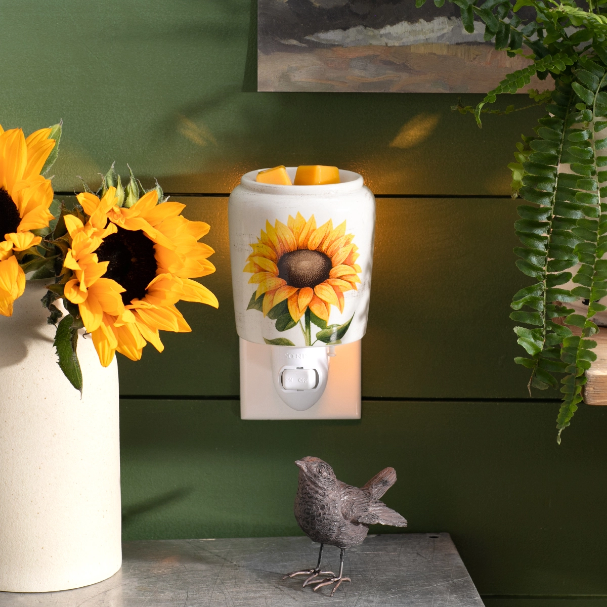White ceramic mini warmer with a vibrant sunflower illustration and amber-coloured interior, the Sunflower Mini Scentsy Warmer