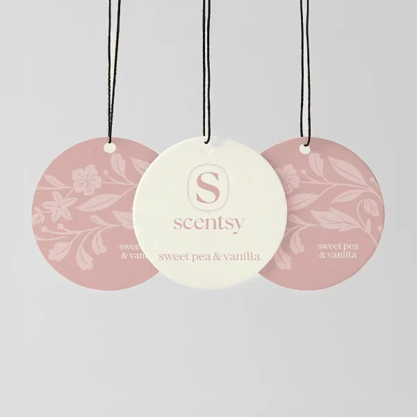 Sweet Pea & Vanilla Scent Circle 3-pack - Three circular hanging scent circles with black strings, one cream with the Scentsy logo and two mauve with floral patterns, for Sweet Pea & Vanilla Scent Circle 3-pack