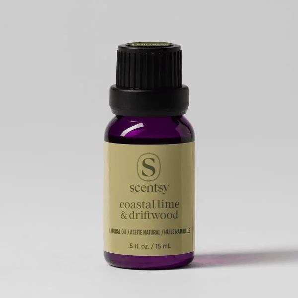 Coastal Lime & Driftwood Natural Oil Blend - Dark purple glass bottle with a black screw cap and cream-coloured label displaying the Scentsy logo and "Coastal Lime & Driftwood Natural Oil Blend" text, 15 mL size