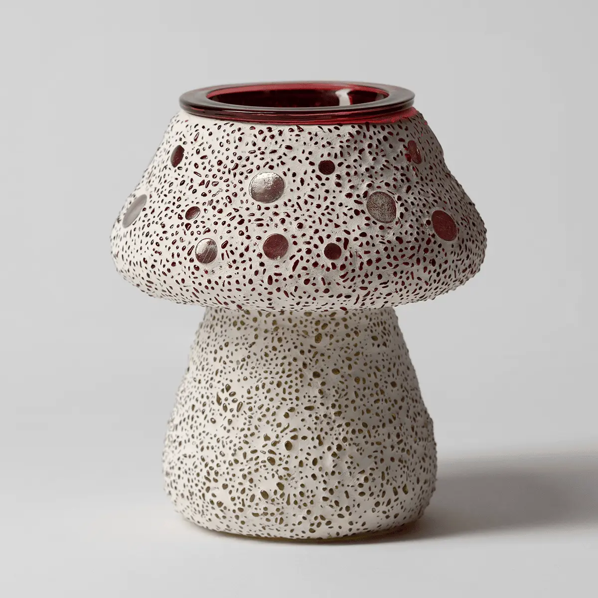 Mushroom-shaped ceramic warmer with all-over dot and speckle texture in cream with burgundy accents and metallic details, the Cute as a Button Scentsy Warmer