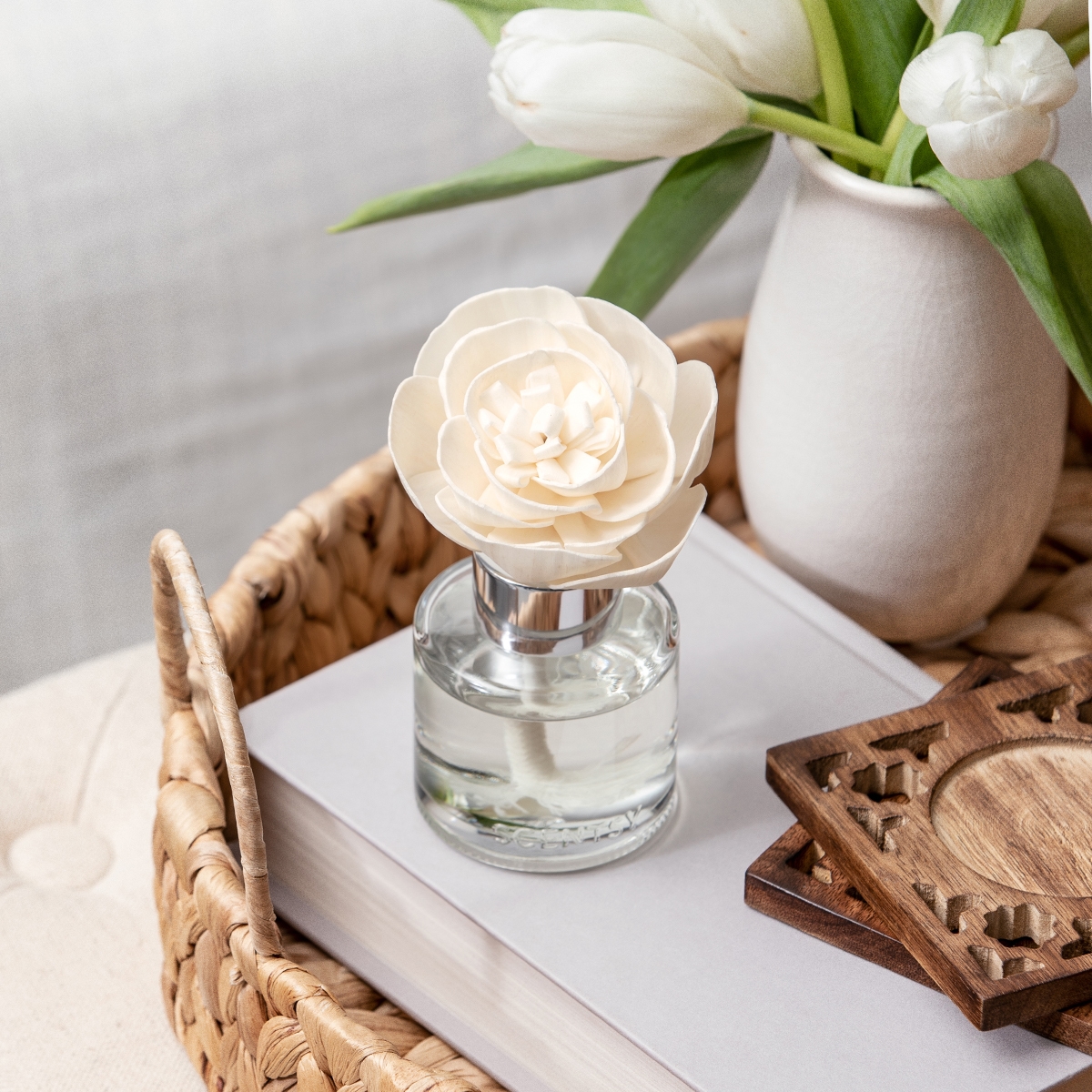 Cream peony-shaped Fragrance Flower with layered petals in a glass vial with silver collar, displaying Go, Go, Mango - Buttercup Belle Fragrance Flower