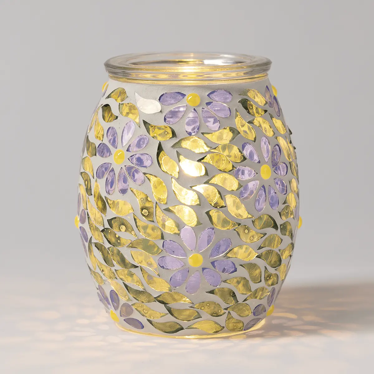 Frosted glass warmer with a barrel shape, decorated with cut-out flowers and leaf patterns in purple, yellow, and olive tones, the Periwinkle Petals Scentsy Warmer