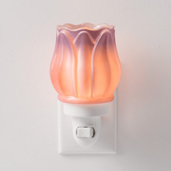 Translucent peach and pink tulip-shaped glass shade with a scalloped rim and vertical ribbed details, mounted on a white plug-in base with an on/off switch, the Prismatic Petal Mini Scentsy Warmer