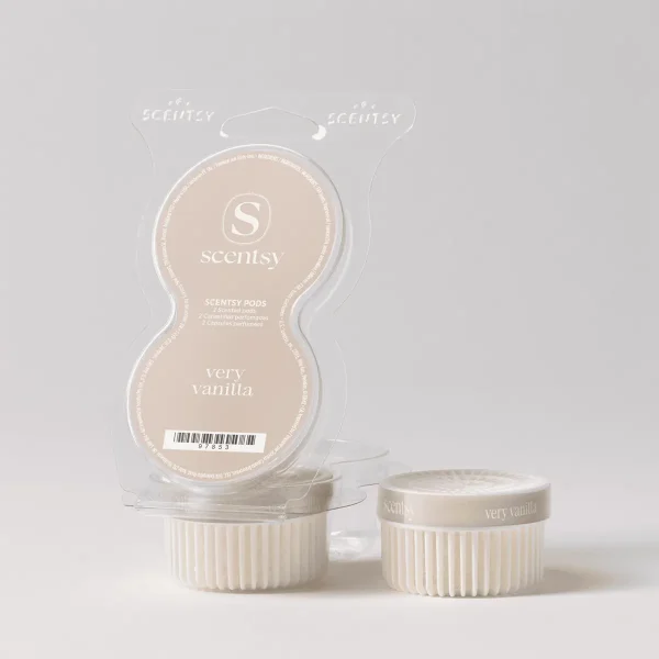 Two cream-coloured ridged wax pods displayed beside their clear clamshell packaging, Very Vanilla Scentsy Pods, against a neutral background