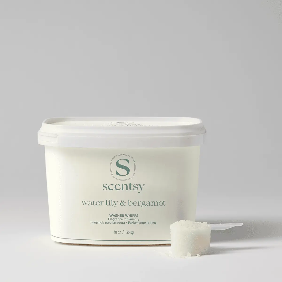 Water Lily & Bergamot Washer Whiffs Tub - Water Lily & Bergamot Washer Whiffs Tub - Cream-coloured tub of Water Lily & Bergamot Washer Whiffs with white lid and a measured scoop of white granules displayed in front