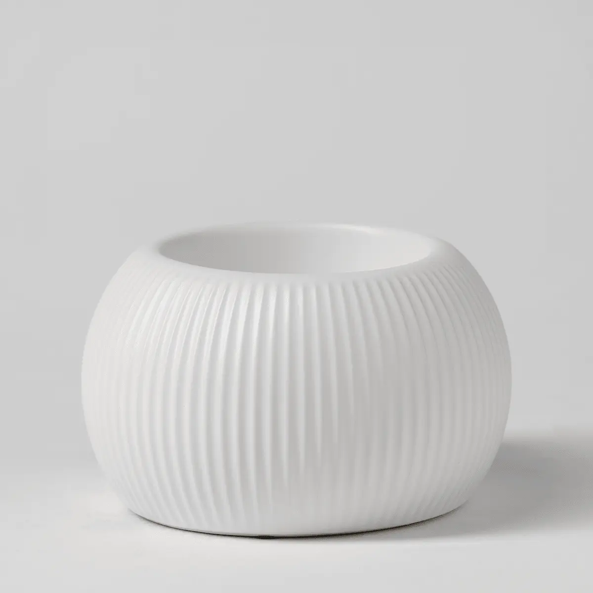 White ceramic warmer with vertical fluted ribbing across the rounded bowl shape, the White Fluted Scentsy Warmer